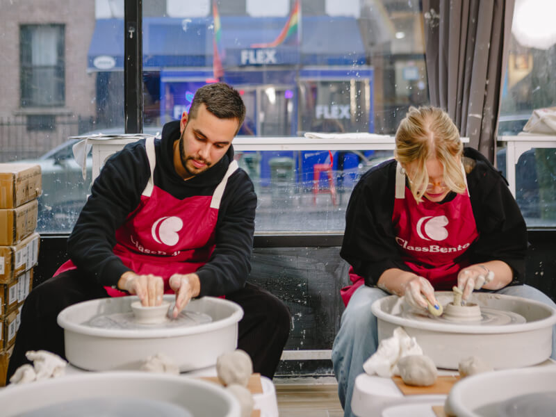 People wheel throwing side by side